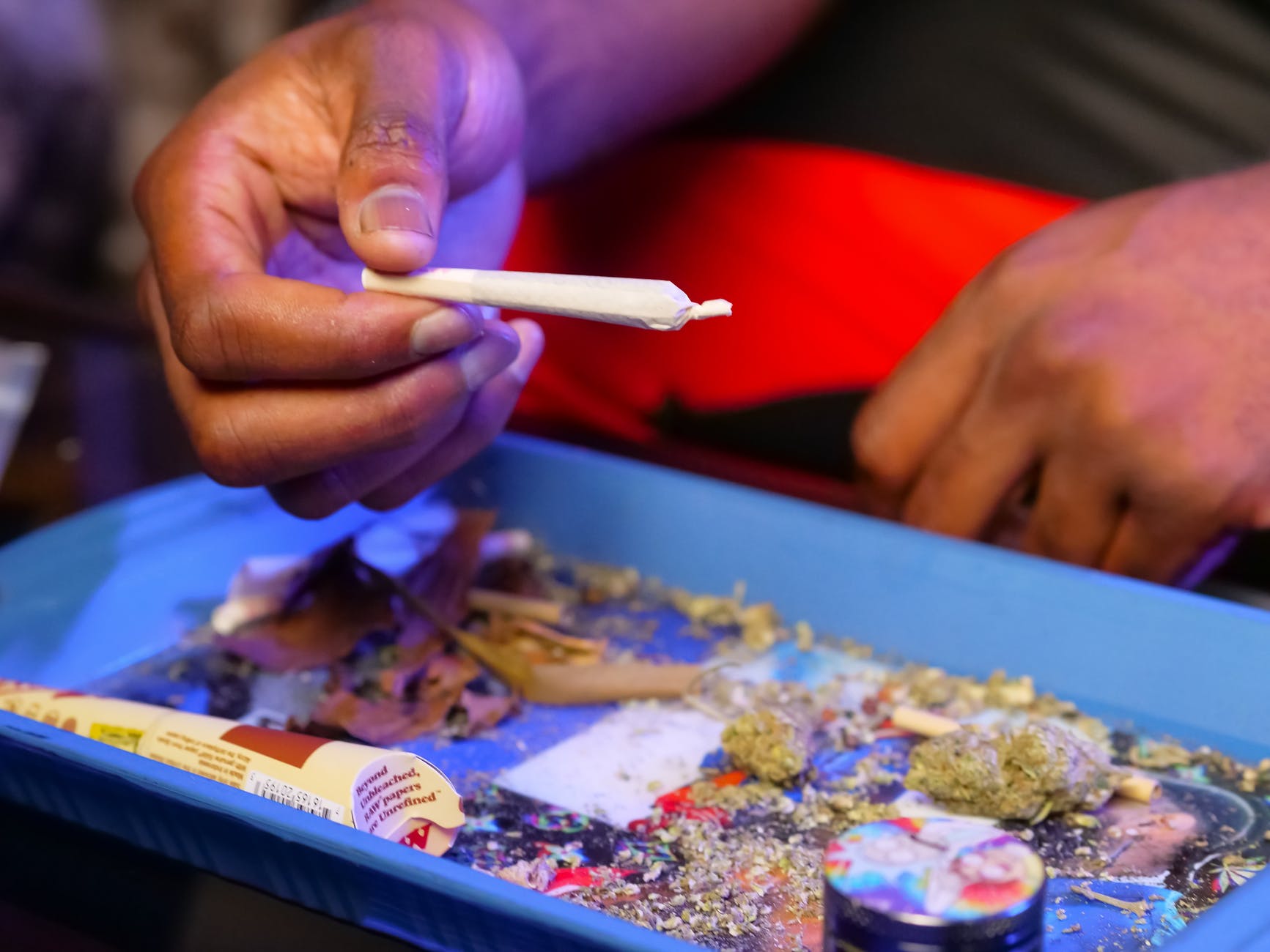close up photo of person holding blunt